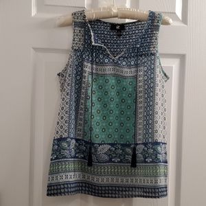 Sleeveless smocked top with tassels